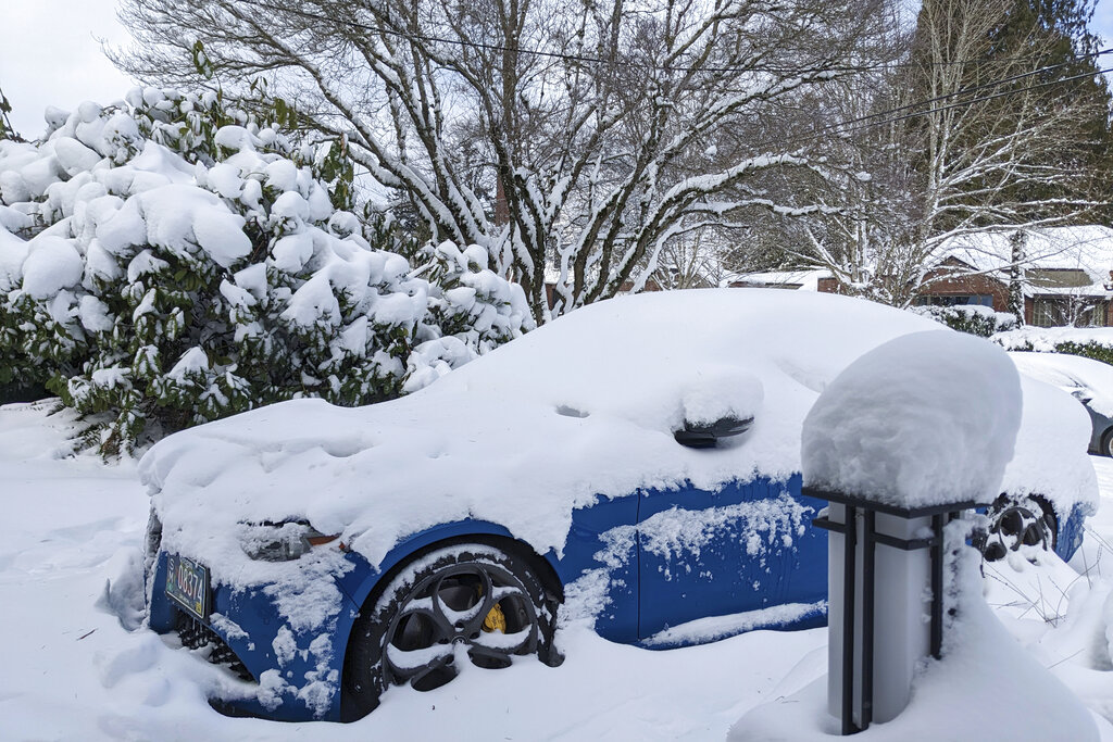 Snow covers a car