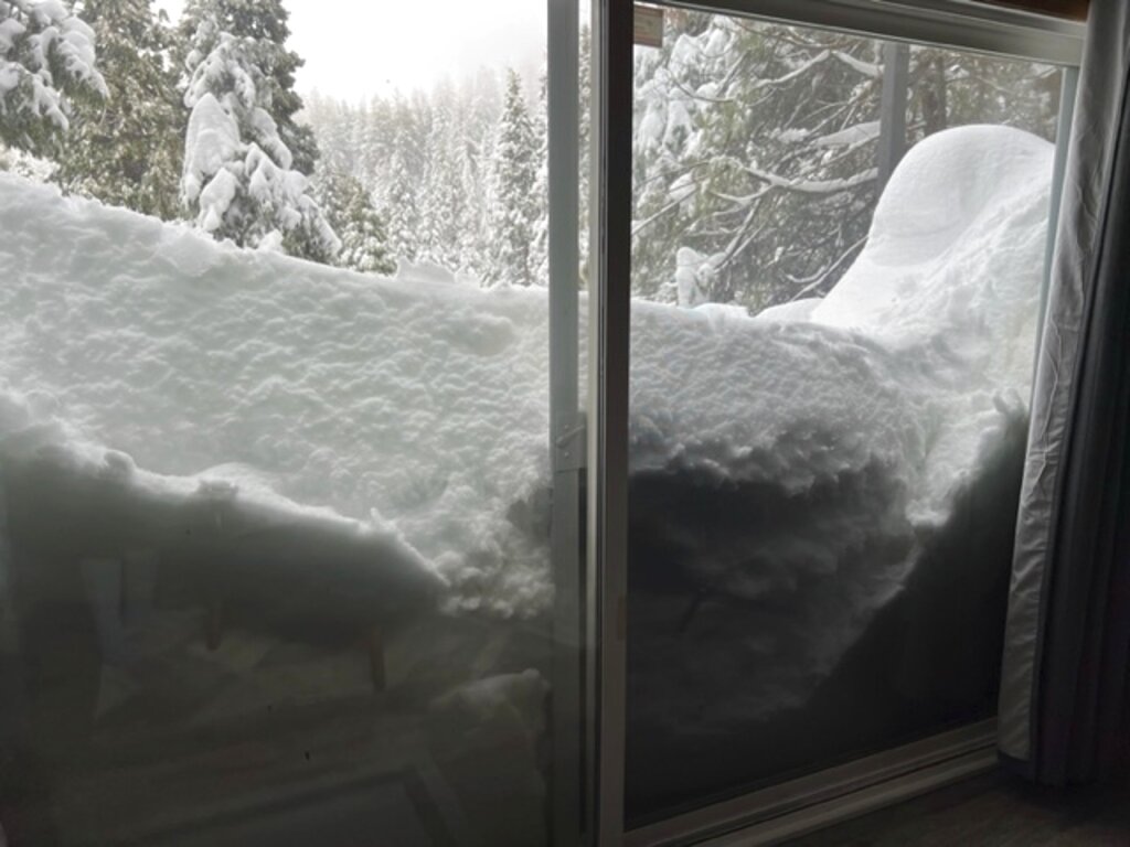 Snow blocks a slider door of Jennifer Cobb