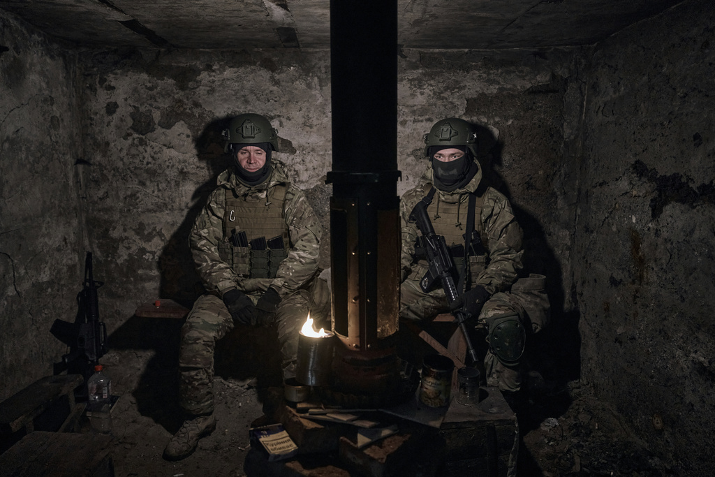 Volunteer soldiers rest in a shelter on their positions close to Bakhmut, Donetsk region, Ukraine
