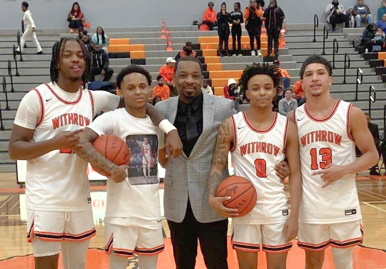 Coach Roberto Allen with Withrow team members