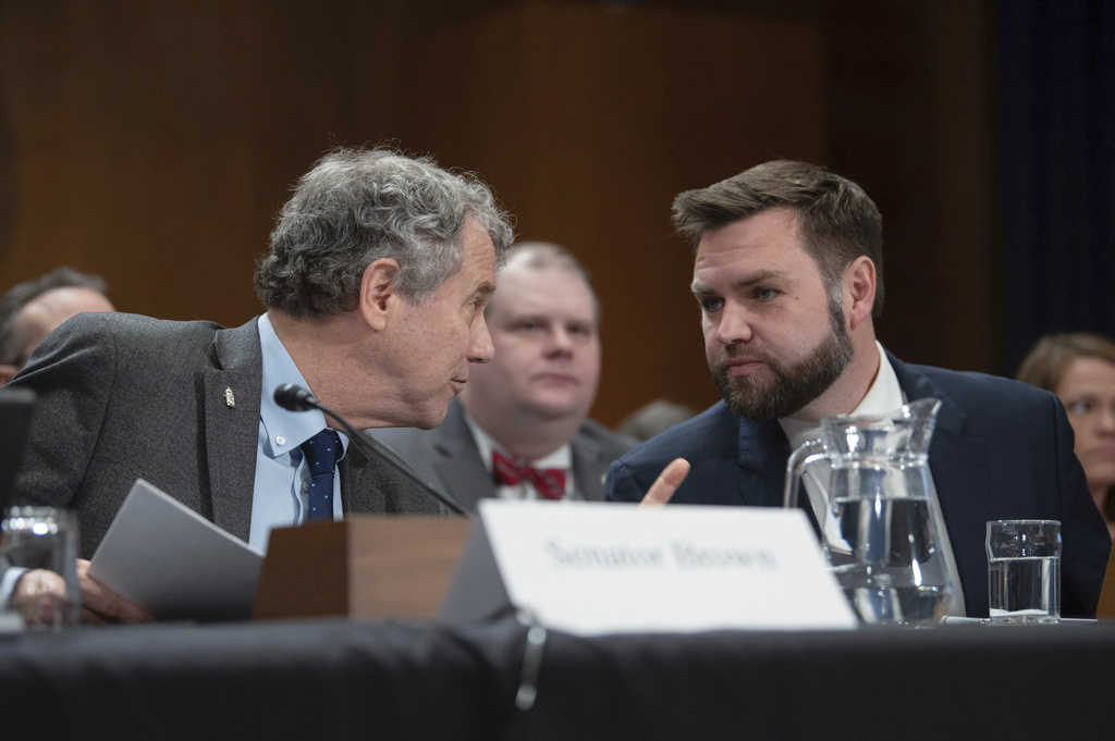 Sen. Sherrod Brown, D-Ohio, left, and Sen. JD Vance, R-Ohio, talk before testifying the Senate Environment and Public Works Committee hearing to examine protecting public health and the environment in the wake of the Norfolk Southern train derailment in East Palestine, Ohio, Thursday, March 9, 2023, in Washington.