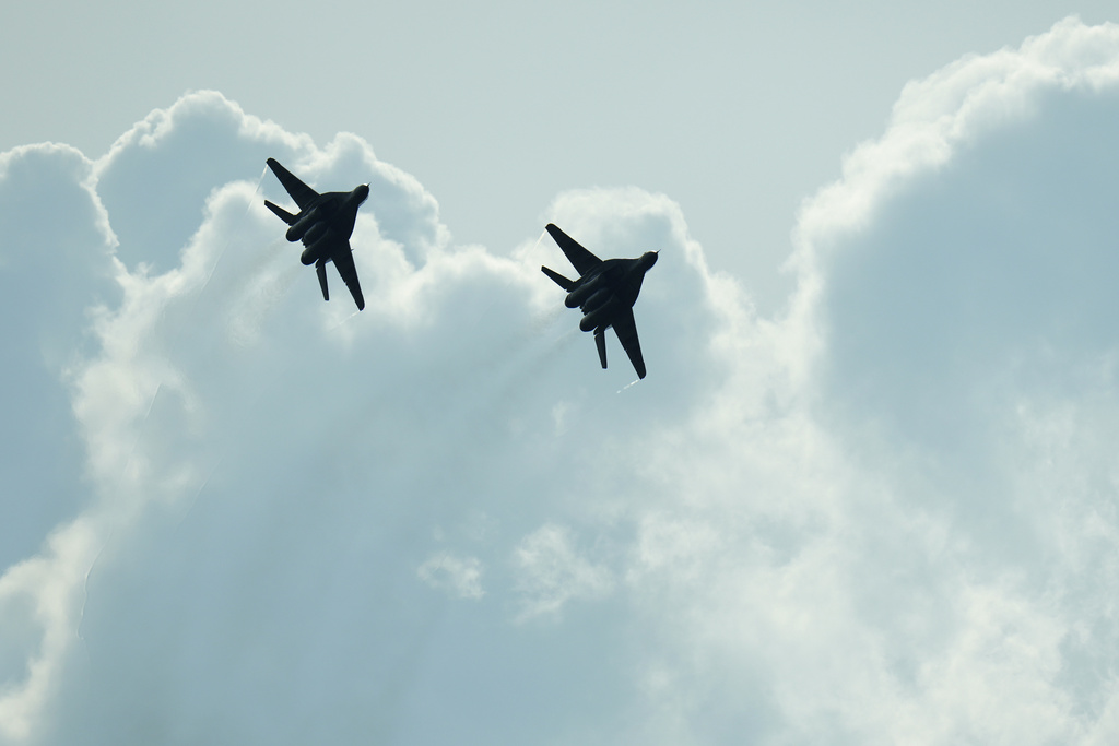 Slovak Air Force MiG-29s fly over an airport during an airshow in Malacky, Slovakia