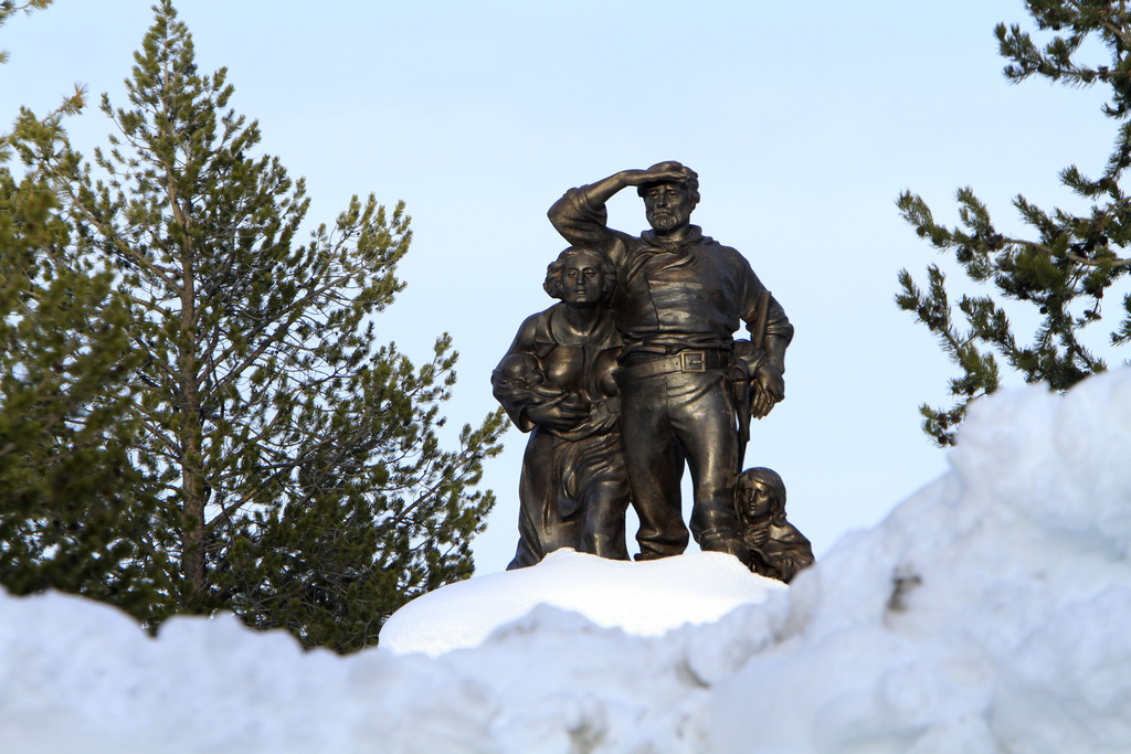 The Pioneer Memorial, dedicated to the Donner Party, is seen behind snow cleared from the parking lot at the Donner Memorial State Park at Truckee, Calif.