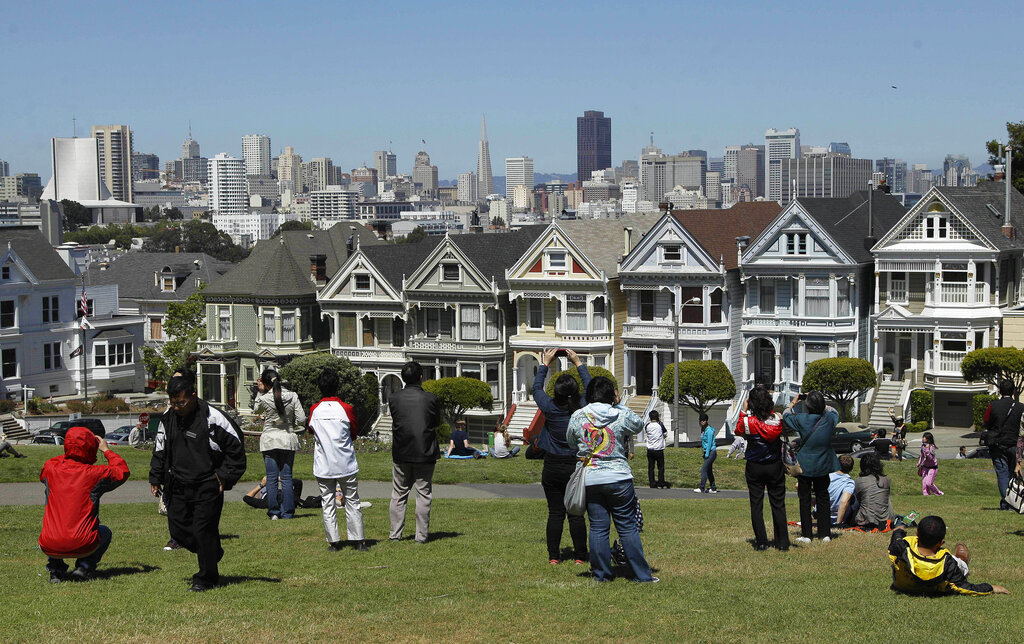 Tourists at park in front of homes from TV series "Full House"