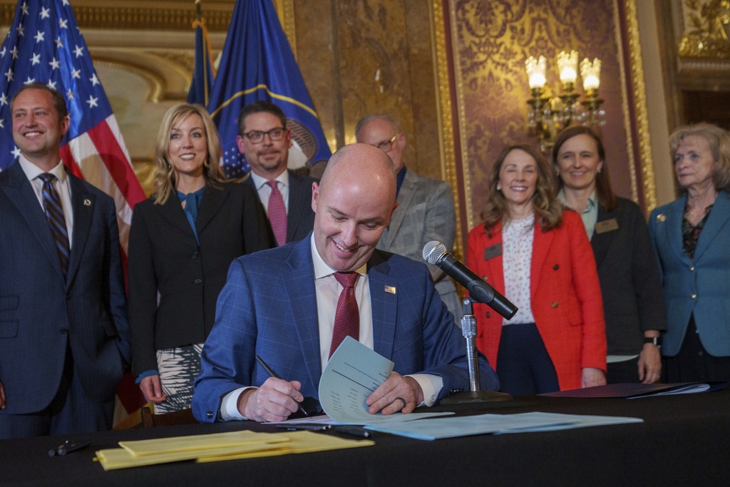 Gov. Spencer Cox signs two social media regulation bills during a ceremony at the Capitol building in Salt Lake City