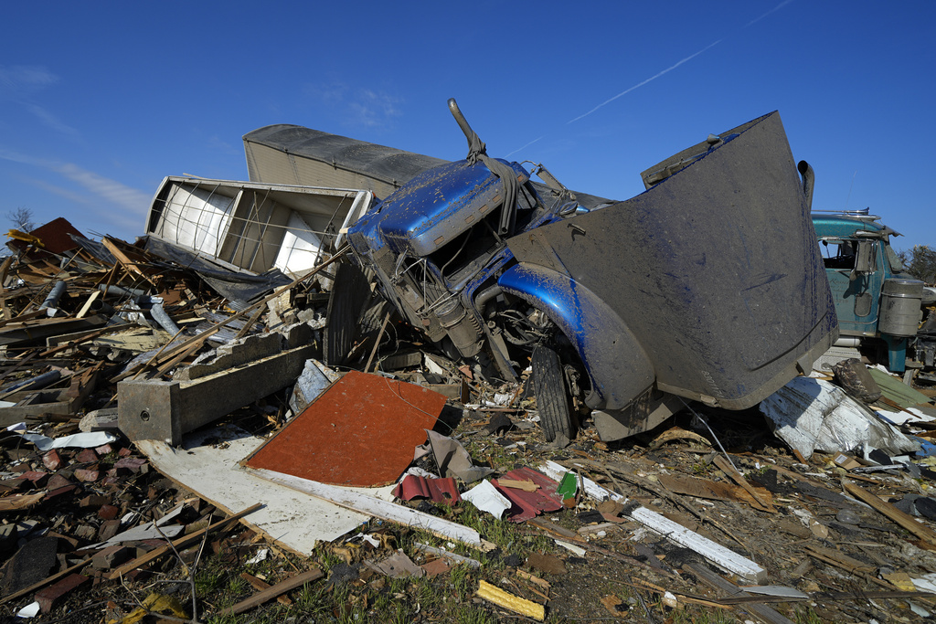 Two semis are seen bunched up, Sunday in Rolling Fork, Miss., after they were moved by a tornado two days earlier.