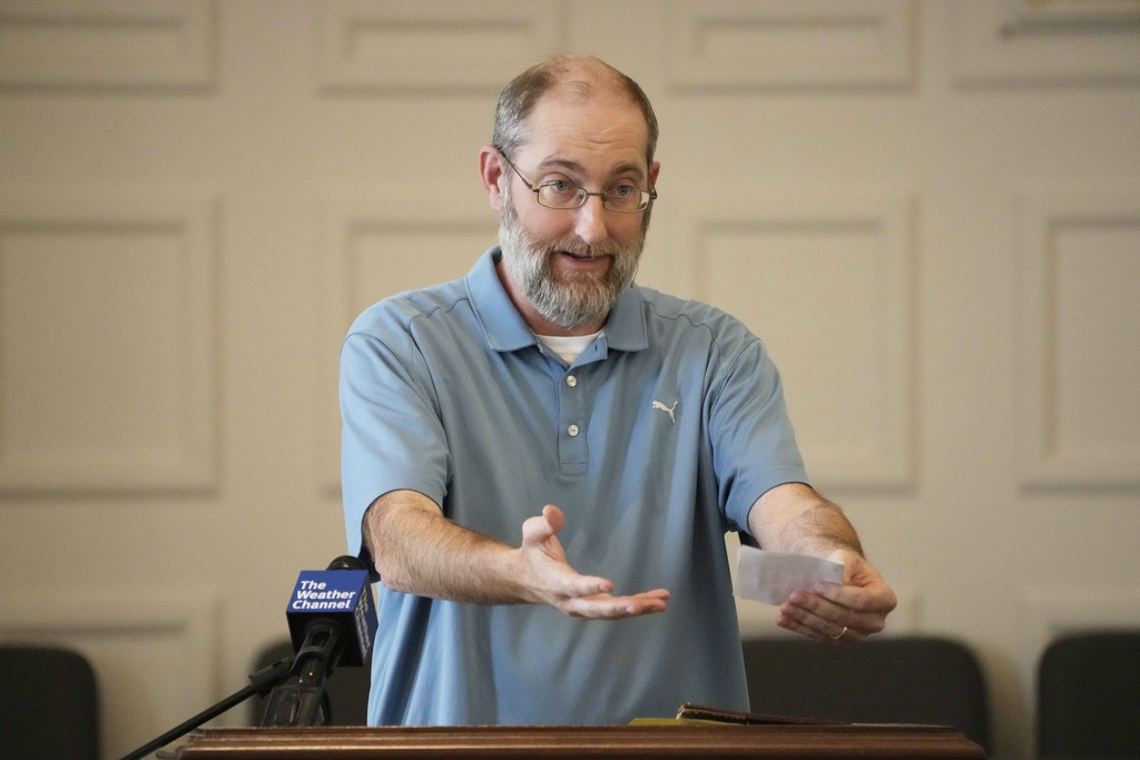 First Baptist Church Pastor Britt Williamson speaks to the congregation during a service, Sunday