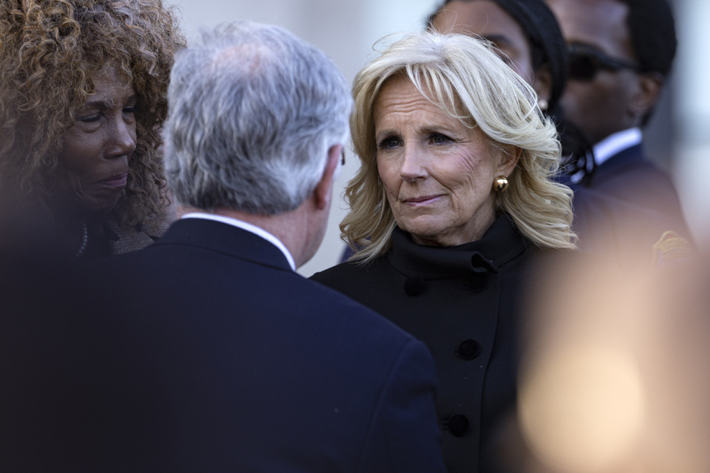 First lady Dr. Jill Biden listens to Nashville mayor John Cooper during a vigil held for victims of The Covenant School shooting 