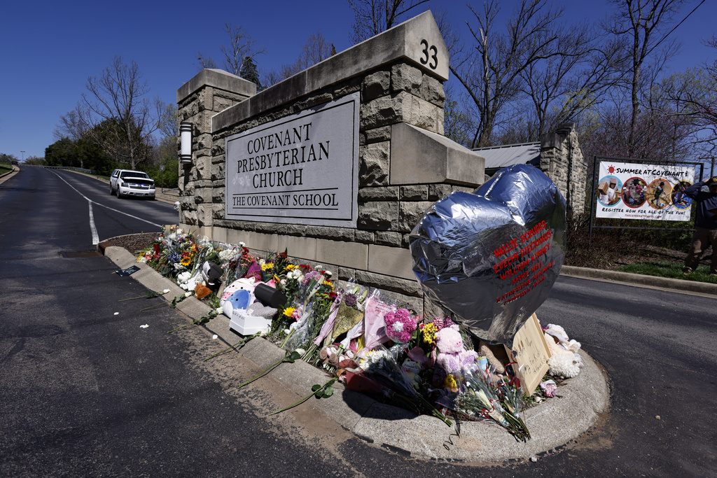 A balloon with names of the victims is seen at a memorial at the entrance to The Covenant School on Wednesday, March 29, 2023, in Nashville, Tenn.