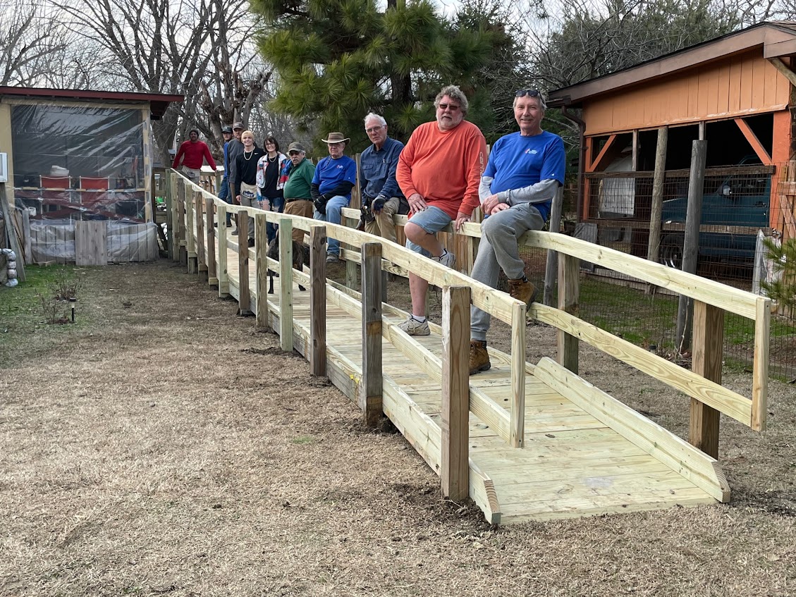 Ramp ministry members posing on finished ramp
