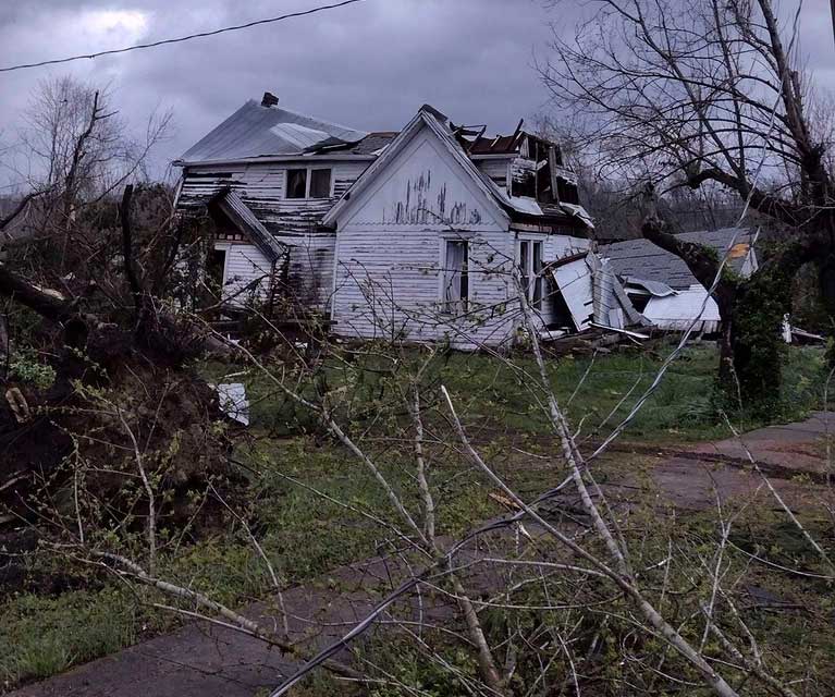 Debris covers the ground as homes are damaged after severe weather in Glen Allen, Mo