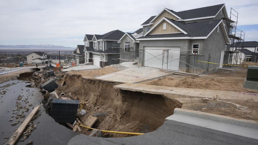 Local officials issued evacuation orders for at least 20 homes as temperatures spiked and snowmelt coursed through the streets in Kaysville, Utah