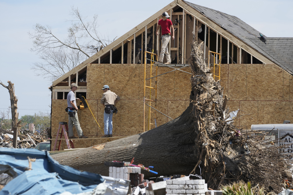 Work crews rebuild the walls to this Rolling Fork, Miss., home