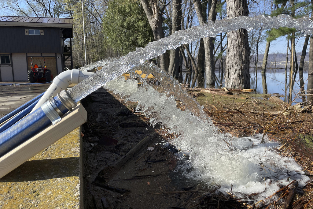 Pumps draining Mississippi River flood waters from a crawl space beneath Amy Werner