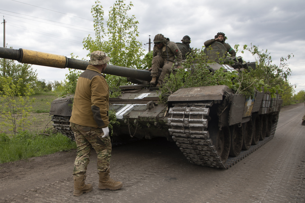 Ukrainian tank rides on the road near Bakhmut, Donetsk region