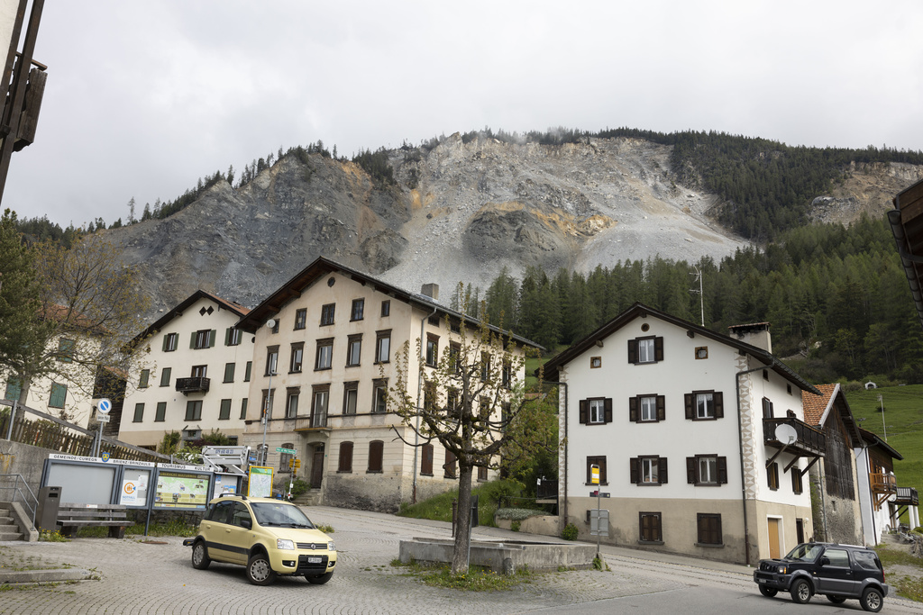 Residential buildings stand in front of the "Brienzer Rutsch" the rockfall danger zone in Brienz-Brinzauls, Switzerland
