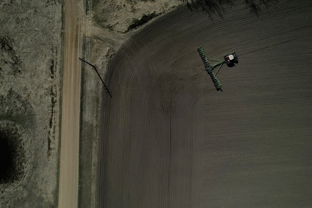 Crop farmer Bob Worth plants corn in one of the many fields on his family