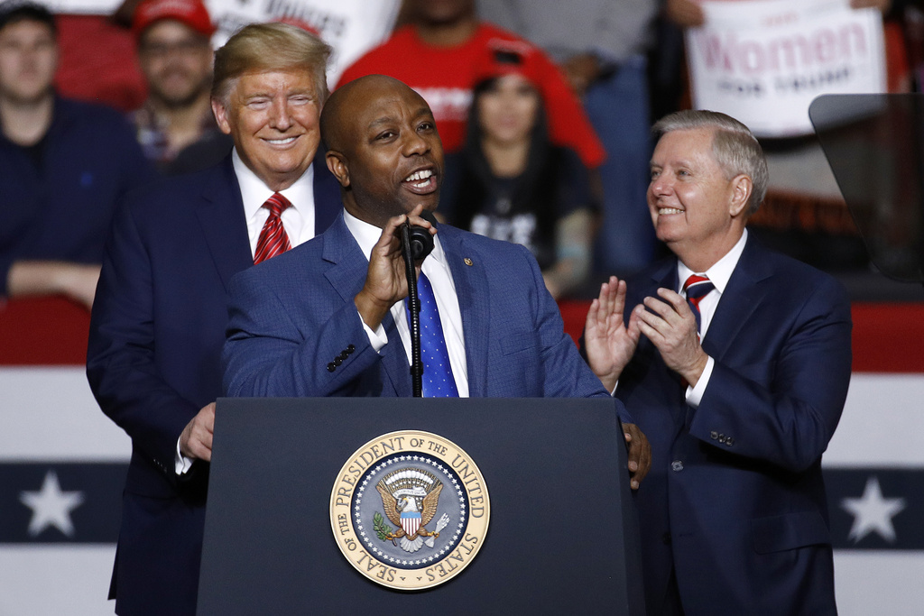 (2020) Sen. Tim Scott, R-S.C., speaks in front of President Donald Trump and Sen. Lindsey Graham, R-S.C.