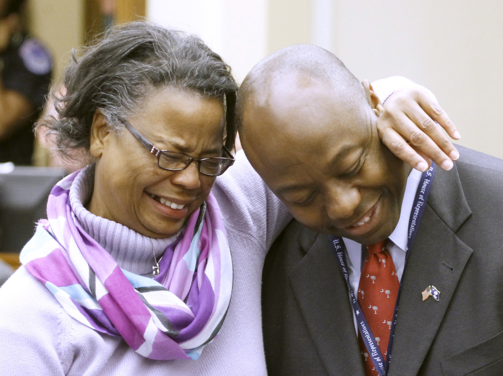 (2010) Tim Scott, R-S.C., right, is hugged by his mother Frances Scott