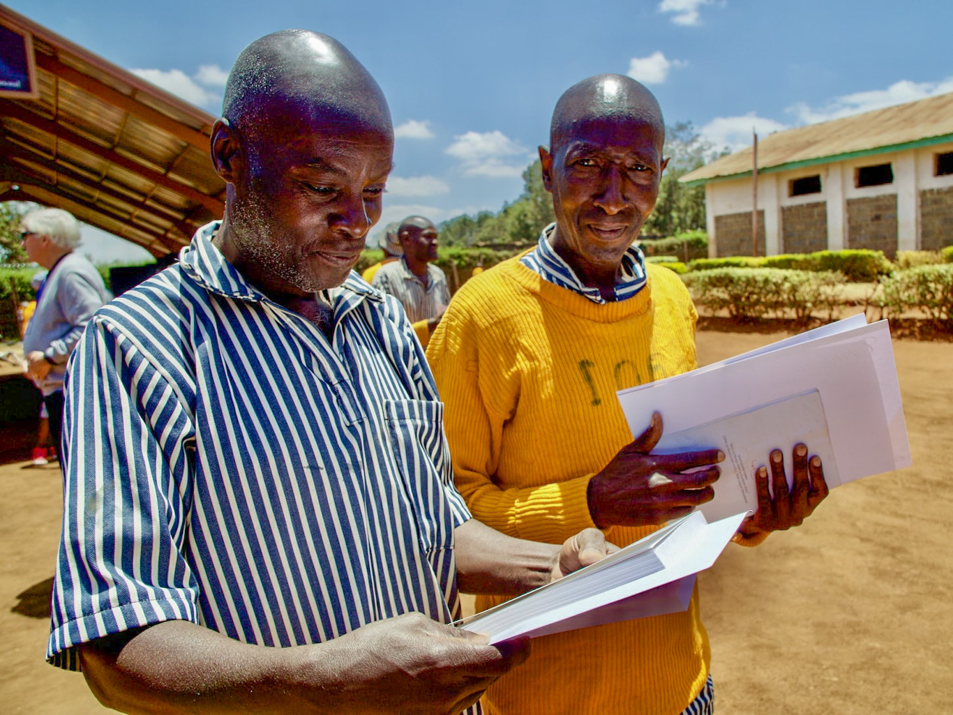 3.	Graduates from The Prisoner’s Journey with their graduation certificates and Bible provided in their heart language from Ruiru Prison, Kenya