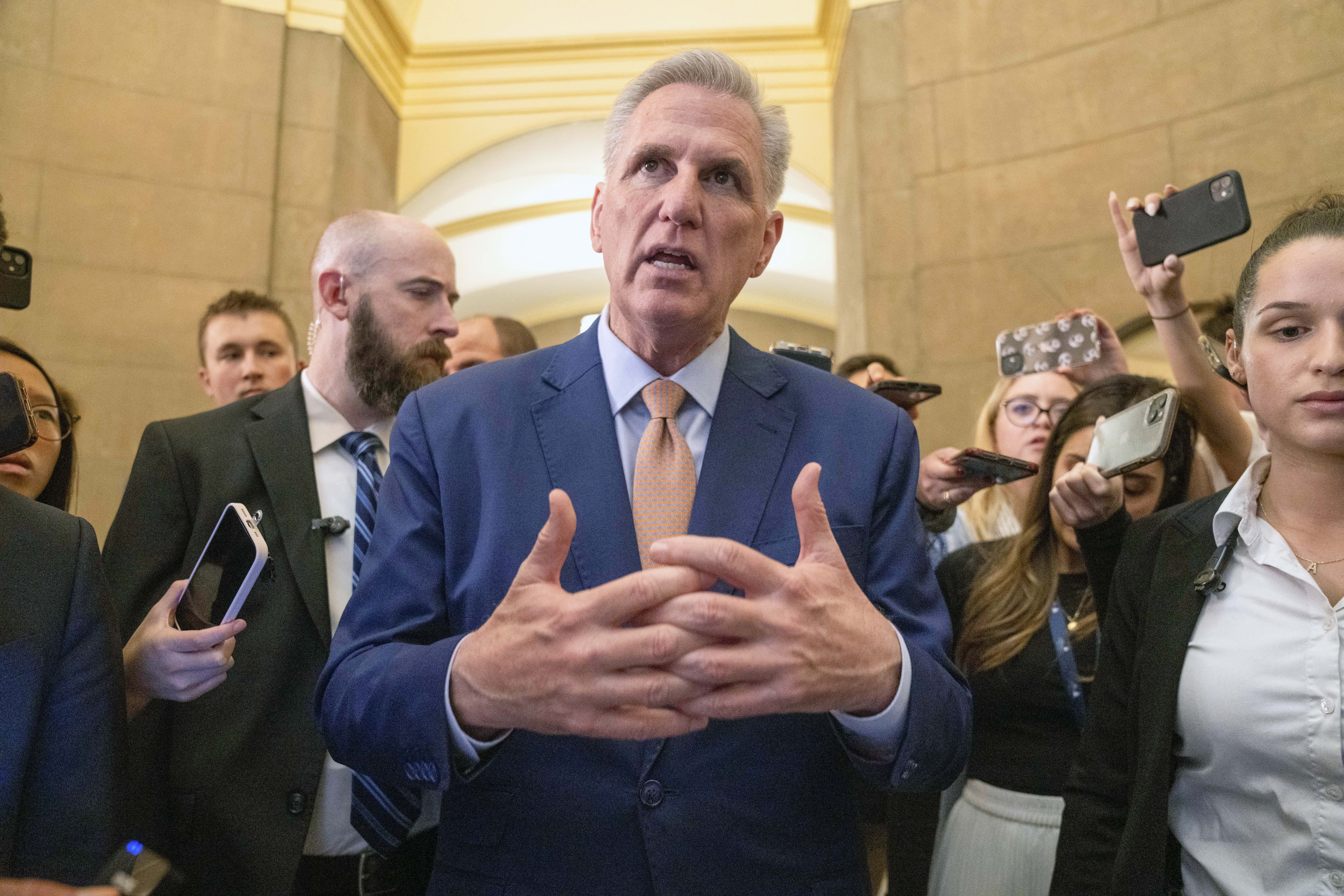 House Speaker Kevin McCarthy of Calif., speaks to reporters, Tuesday, May 23, 2023, as returns to his office from the House floor on Capitol Hill in Washington, as debt limit negotiations continue.