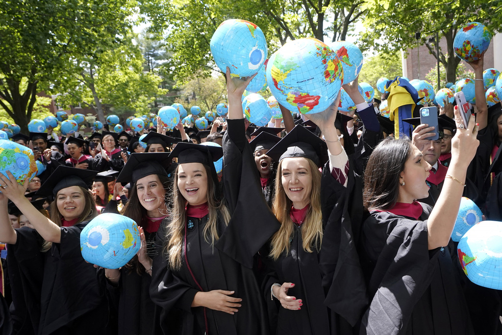 Graduating Harvard University students celebrate their graduate degrees in public policy during Harvard commencement ceremonies