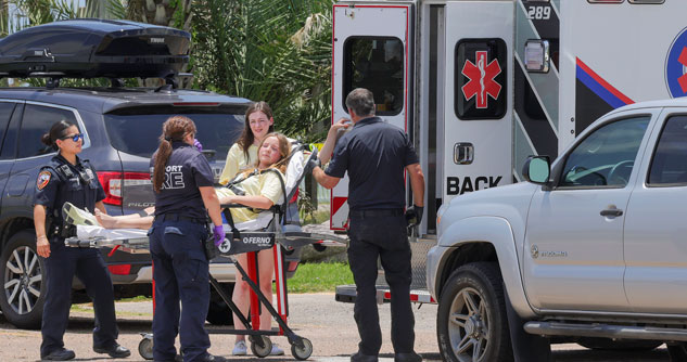 Injured teen on a gurney with EMTs