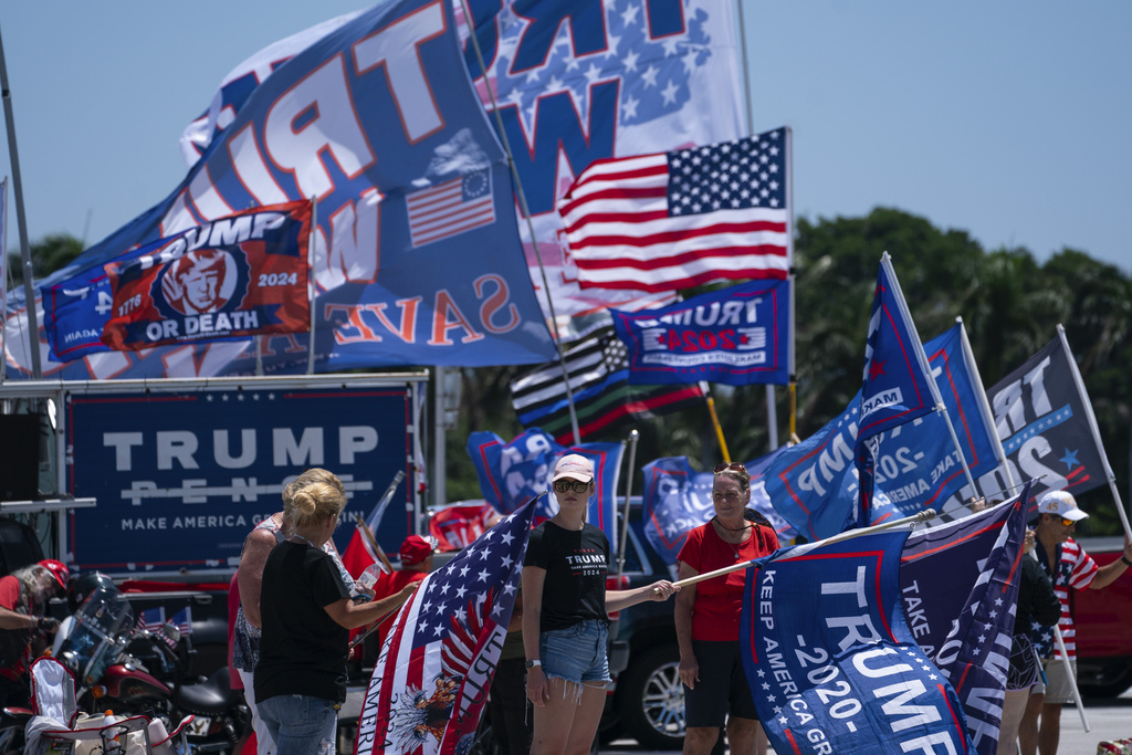 Supporters of former President Donald Trump gather outside Mar-A-Lago, Sunday, June 11