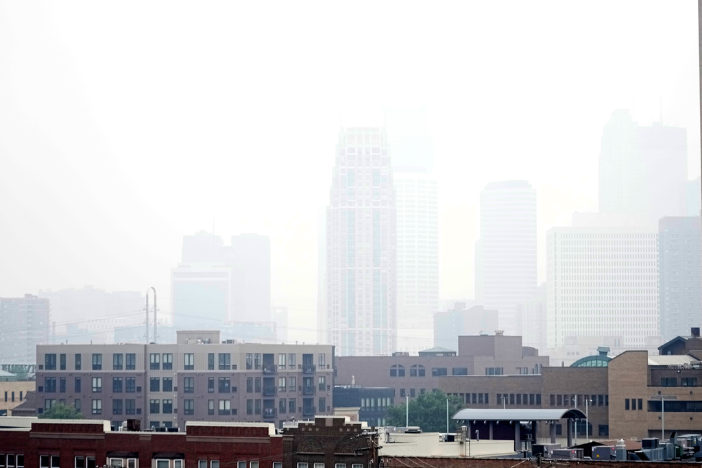 Haze envelopes the Minneapolis skyline from smoke drifted over from the wildfires in Canada