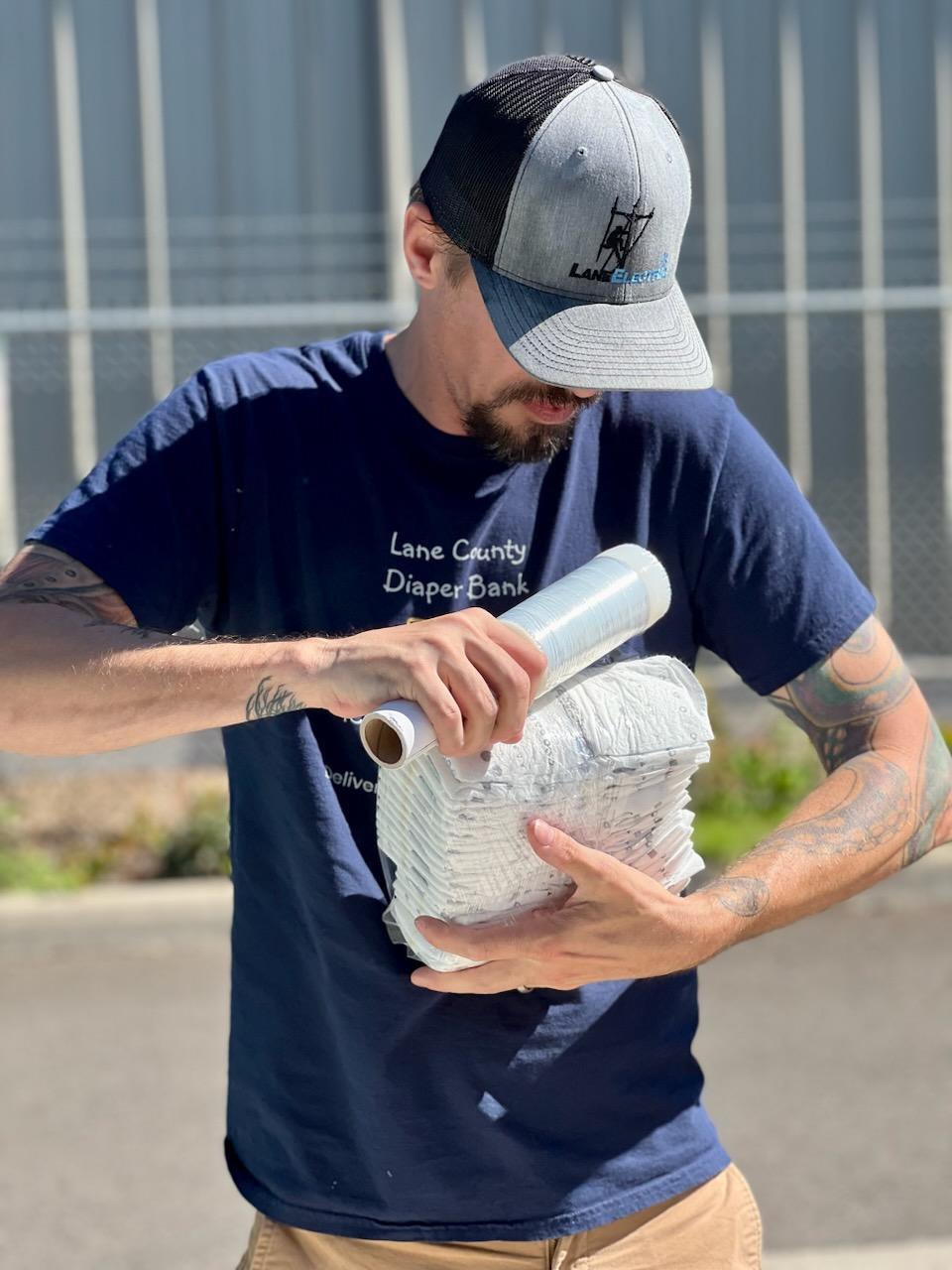 Man holding Diaper Supplies