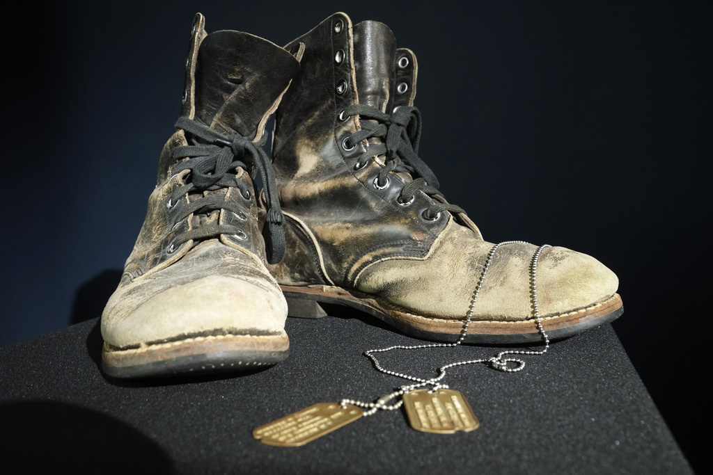 Combat boots and dog tags worn by Alan Alda as he portrayed the wisecracking surgeon Hawkeye on the beloved television series "M-A-S-H"