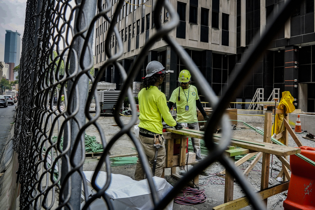 Construction workers work with rebar at a site in NYC