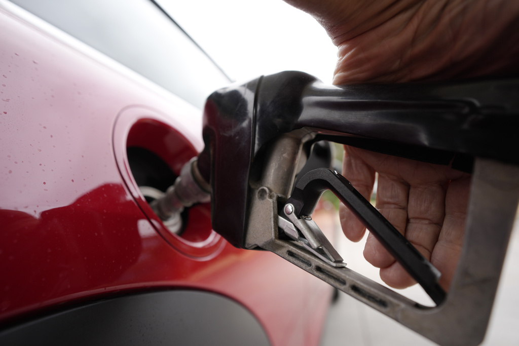 A motorist pumps fuel at a Shell station Wednesday, July 5, 2023, in Englewood, Colo. On Wednesday, the Labor Department reports on U.S. consumer prices for June.