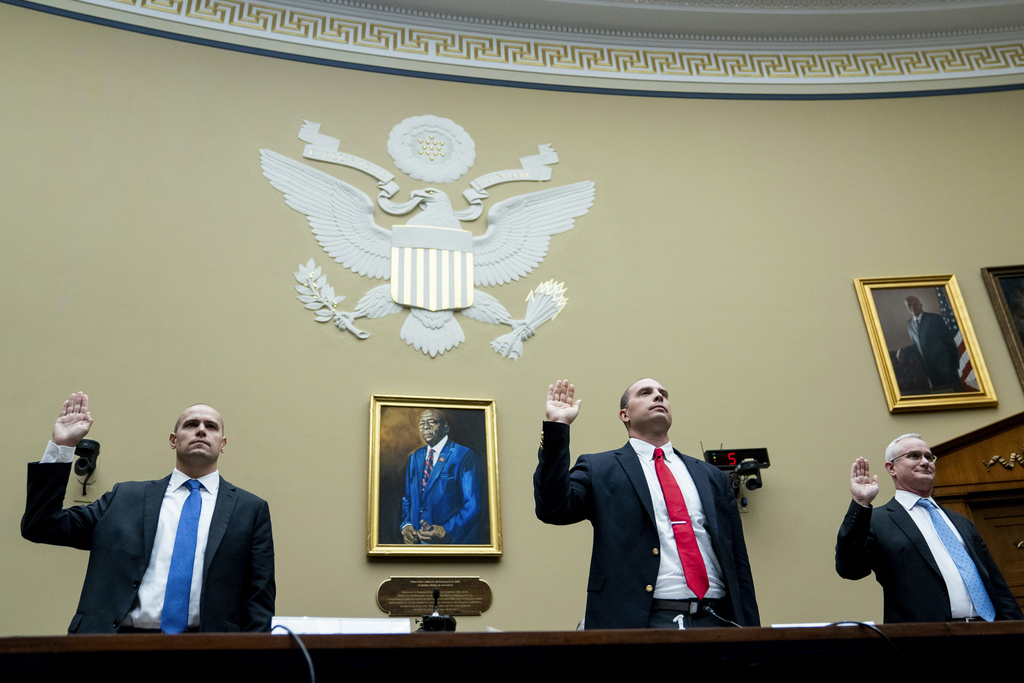 Ryan Graves, Americans for Safe Aerospace Executive Director, from left, U.S. Air Force (Ret.) Maj. David Grusch, and U.S. Navy (Ret.) Cmdr. David Fravor, are sworn in during a House Oversight and Accountability subcommittee hearing on UFOs