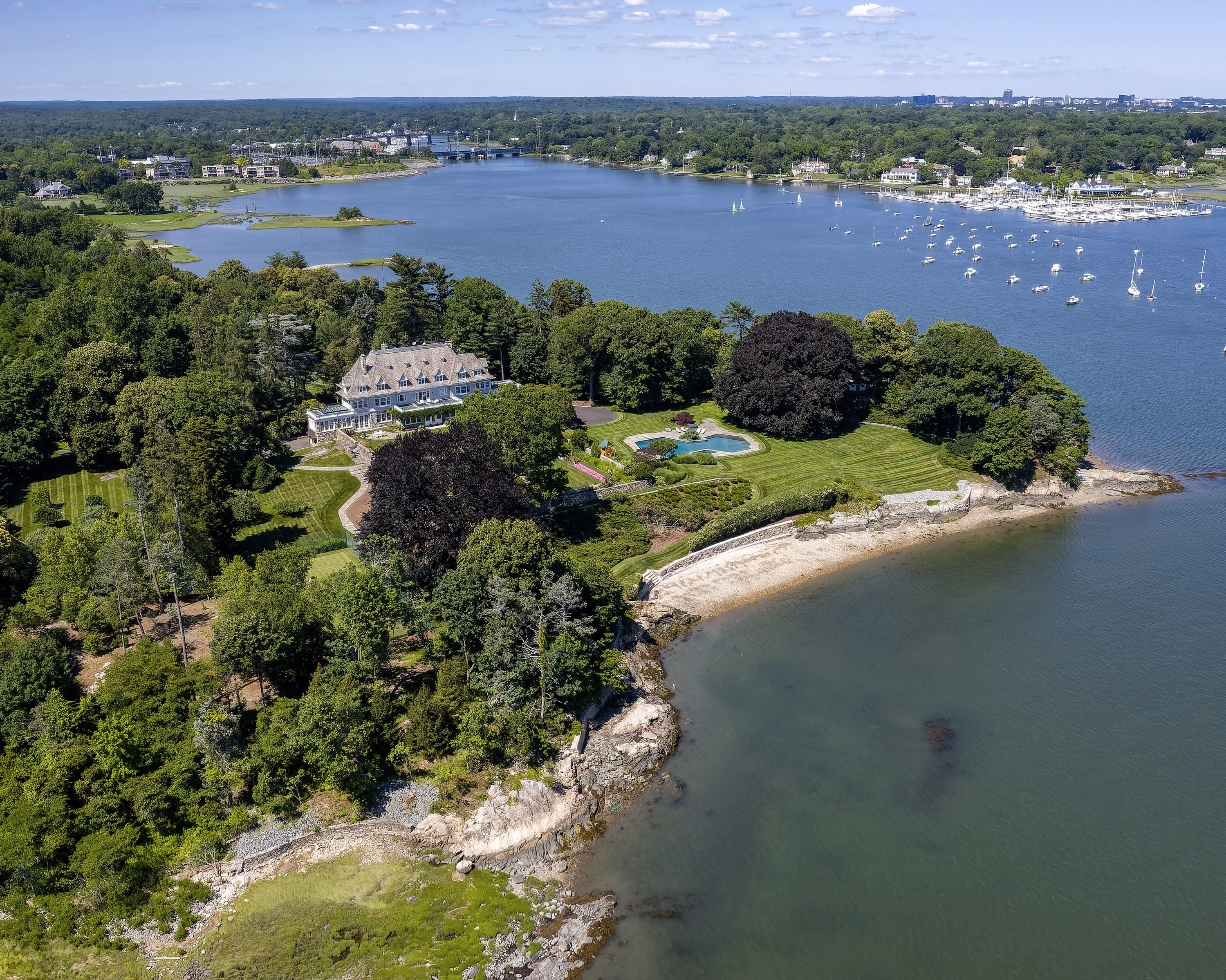 Huge mansion with a large swimming pool and beachfront property