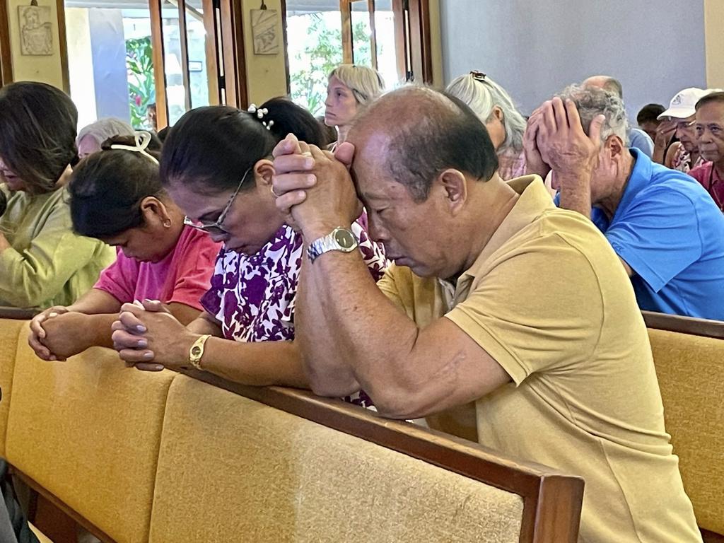 Residents attend service at Sacred Hearts Mission Church in Kapalua, Hawaii