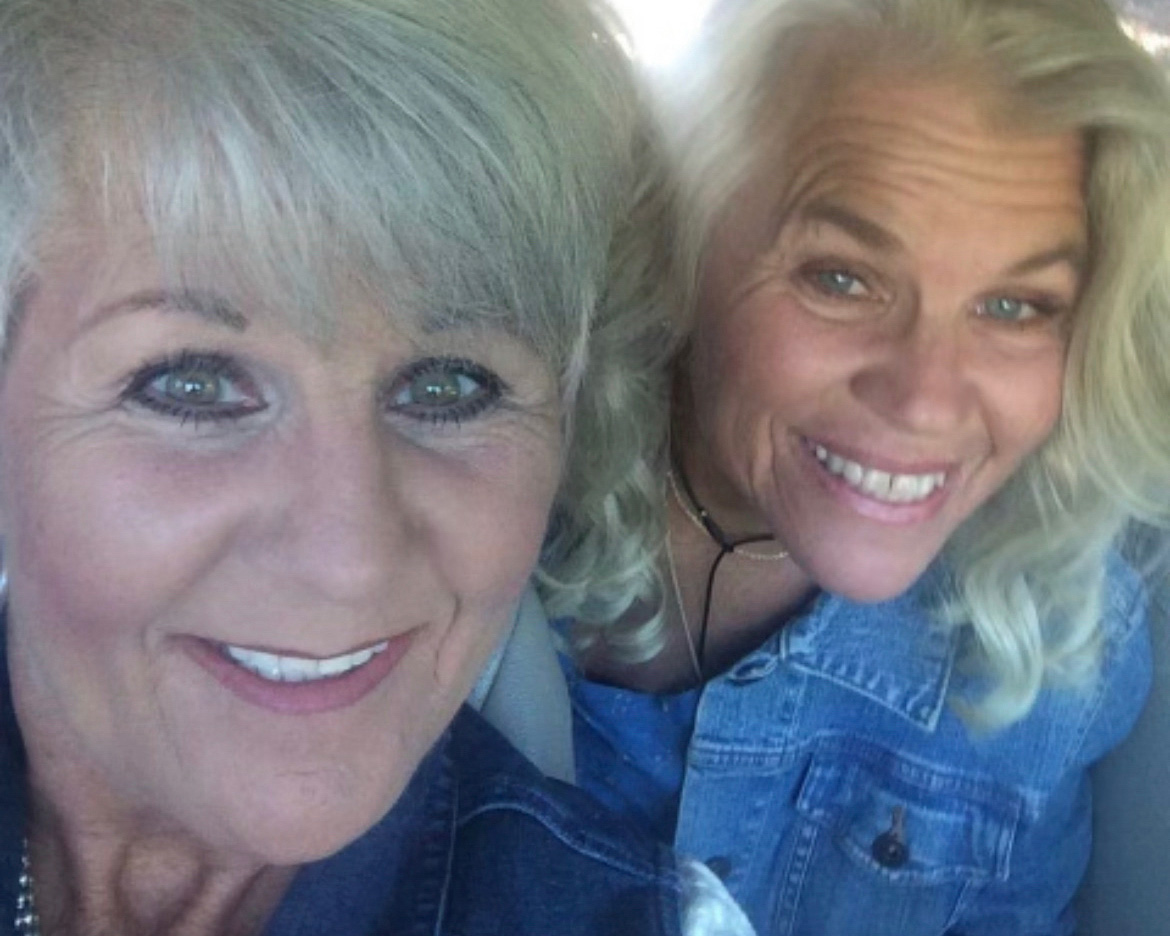 Two women, smiling