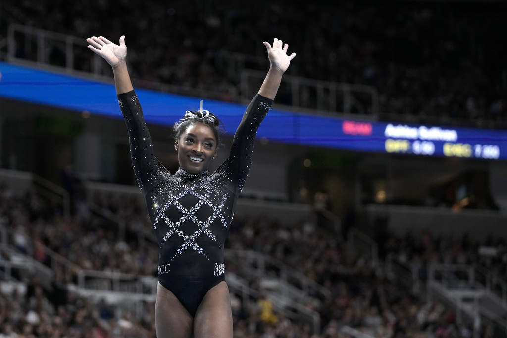 Simone Biles reacts after competing on the floor exercise during the U.S. Gymnastics Championships