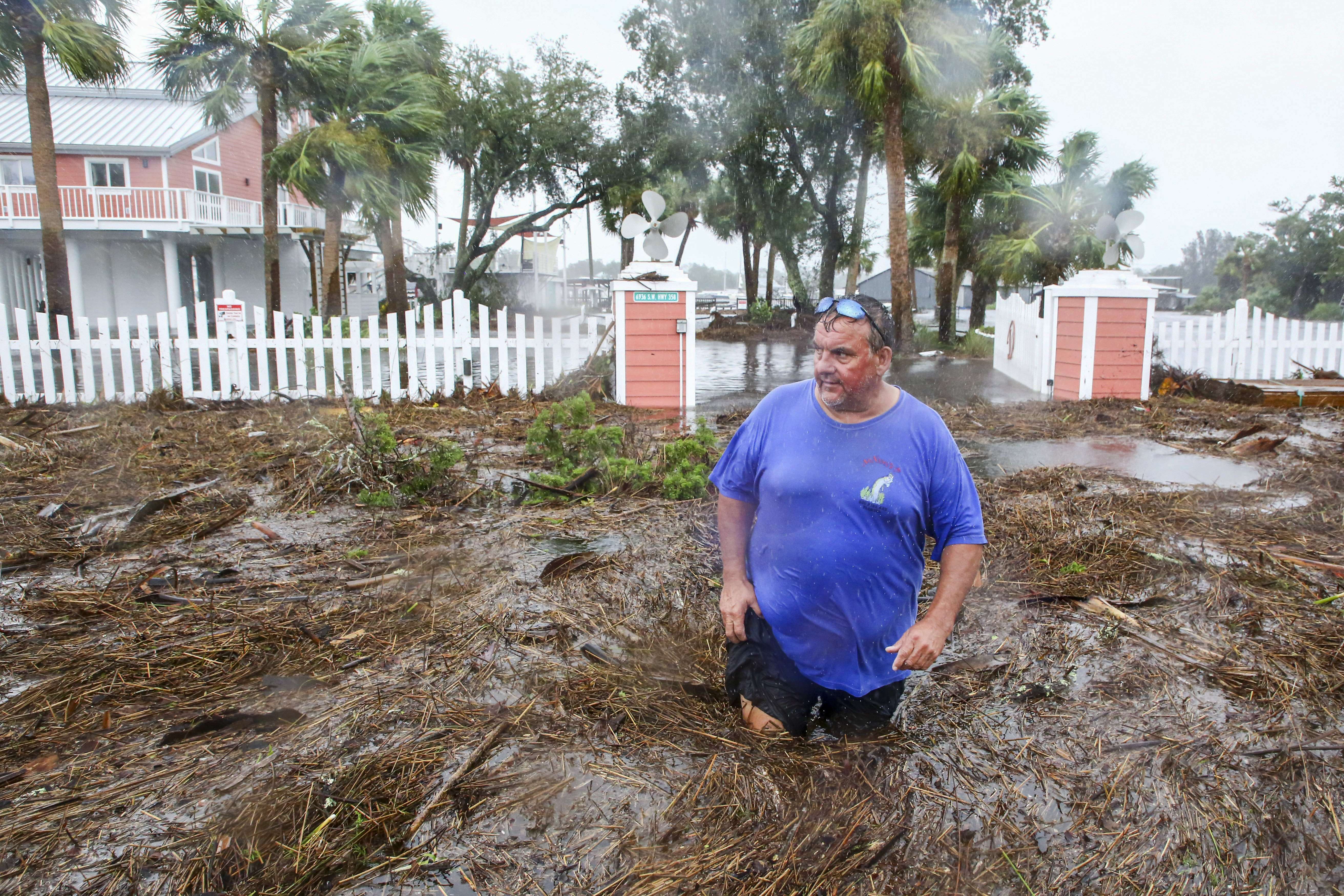 Man wades through watery mess