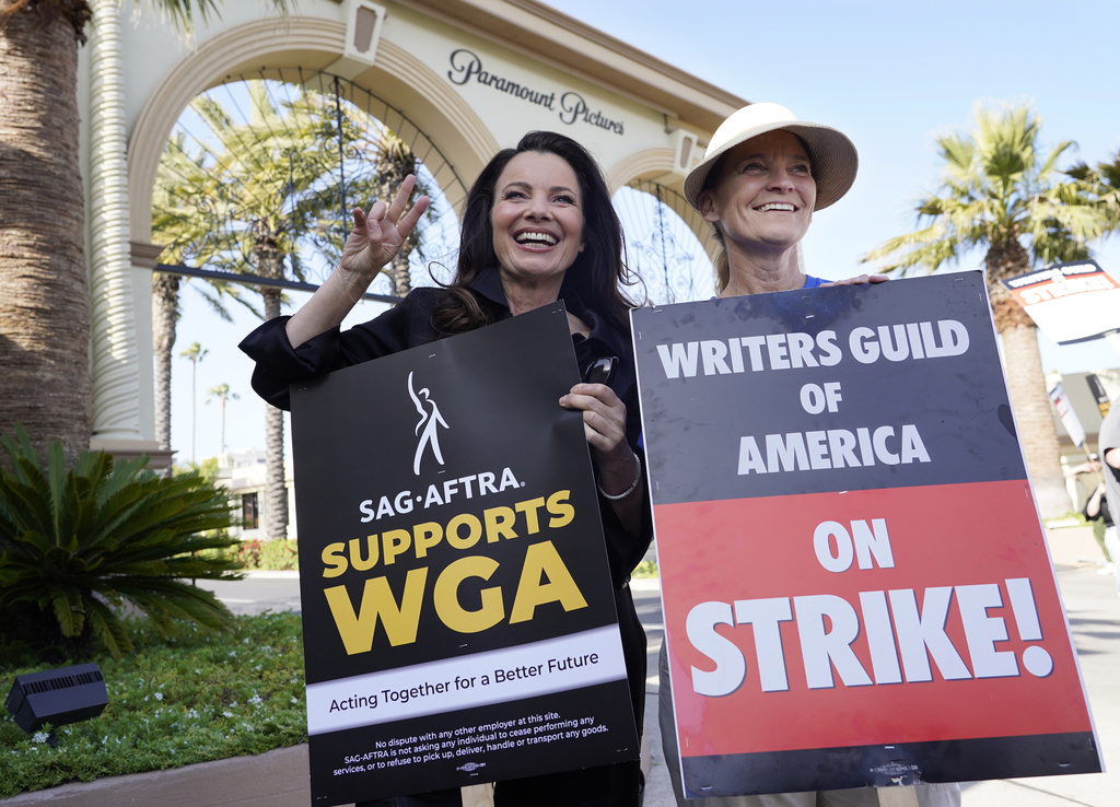 Fran Drescher, left, president of SAG-AFTRA, and Meredith Stiehm, president of Writers Guild of America West, pose together during a rally by striking writers outside Paramount Pictures studio in Los Angeles on May 8, 2023.