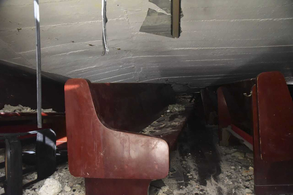 A church roof is seen after it collapsed over the benches of a church in Ciudad Madero, Mexico