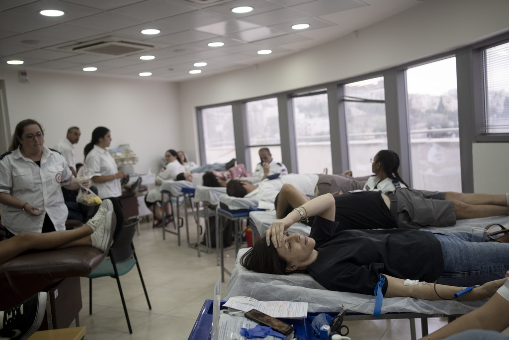 Israelis donate blood at Magen David Adom emergency service in Jerusalem