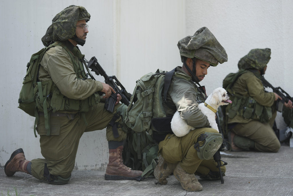 Israeli soldiers deploy in kibbutz Kfar Azza on Tuesday, Oct. 10, 2023. Hamas militants overran Kfar Azza on Saturday, where many Israelis were killed and taken captive.