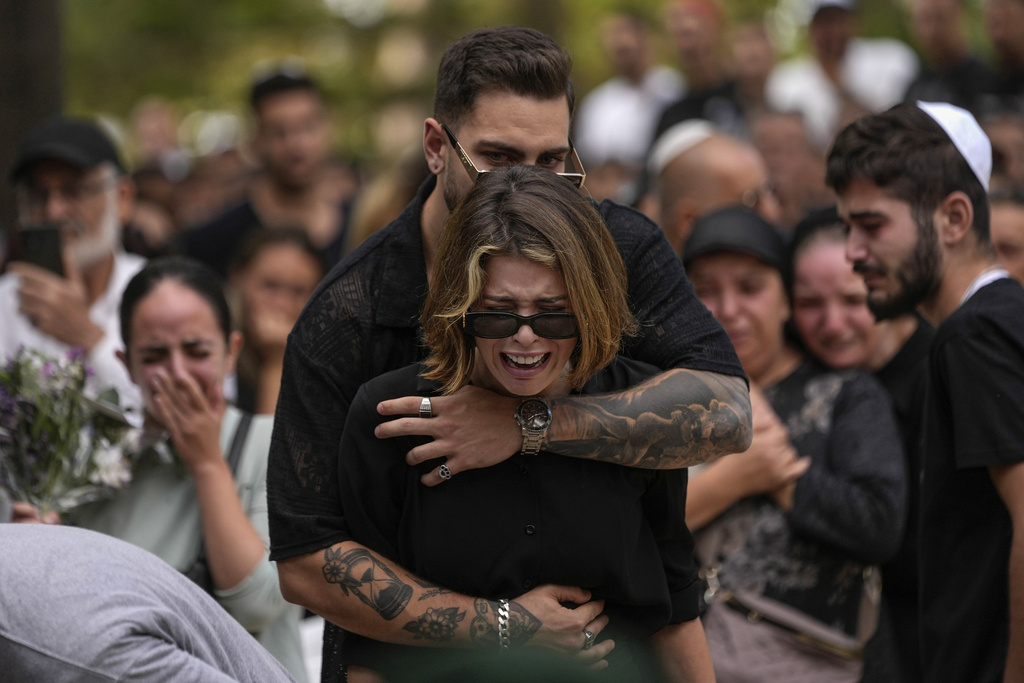 Mourners attend the funeral of Israeli soldier Abraham Cohen at the Mount Herzl cemetery in Jerusalem
