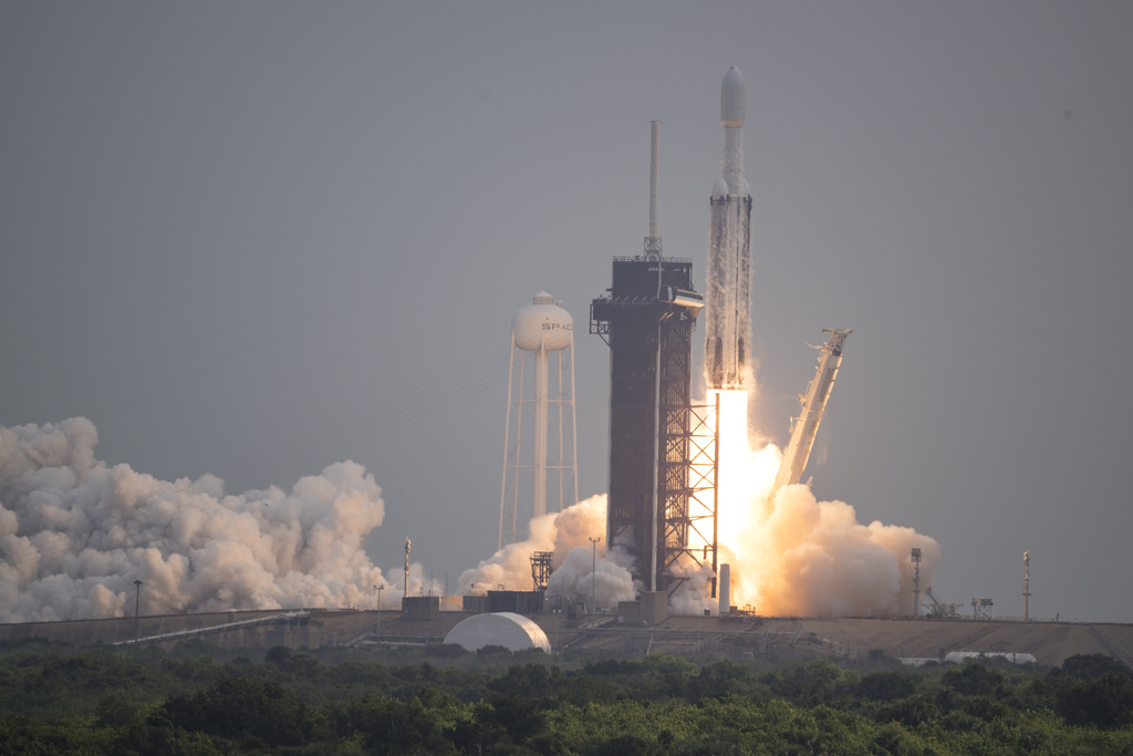 A SpaceX Falcon Heavy rocket lifts off from Launch Pad 39A at the Kennedy Space Center