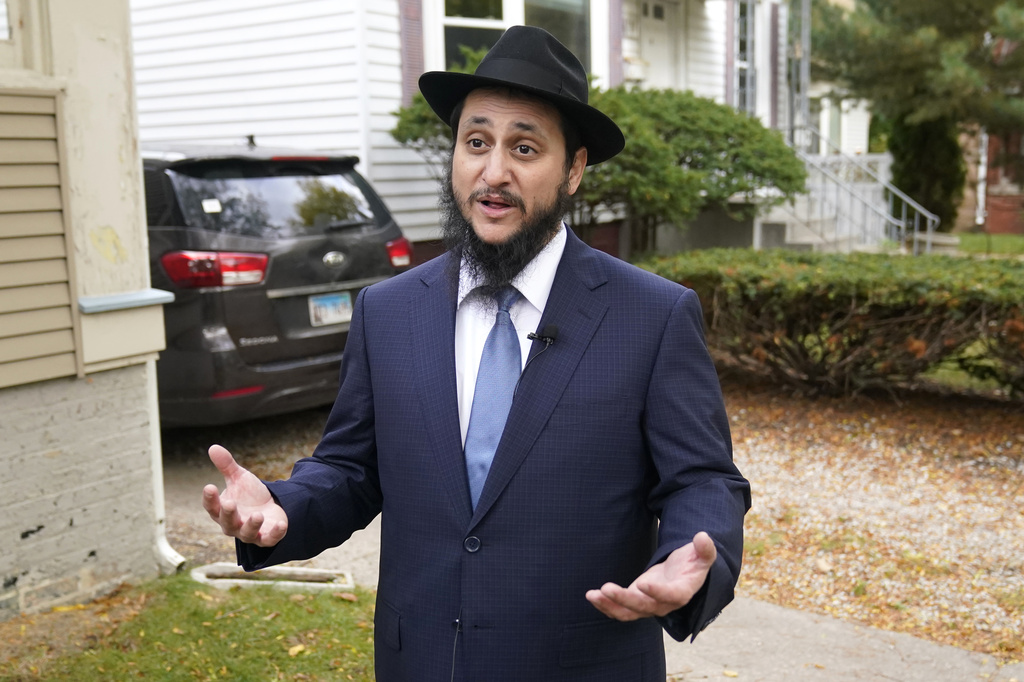 Rabbi Meir Hecht with Chabad of Evanston, Ill., talks with reporters outside his home about the release of Judith Raanan and her daughter Natalie