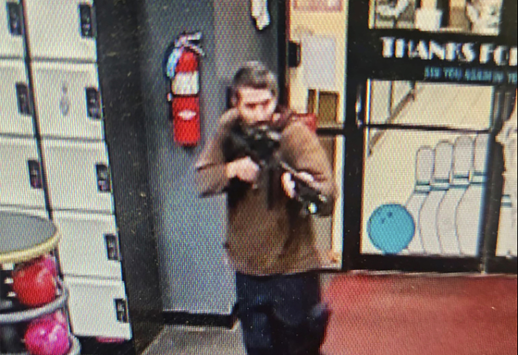 Gunman points a gun while entering Sparetime Recreation in Lewiston, Maine