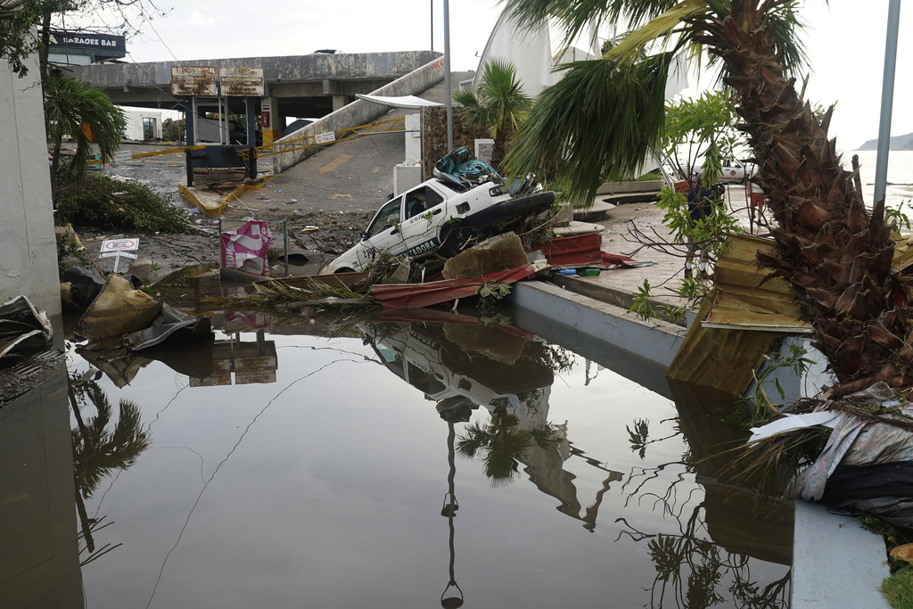 Street is strewn with debris after Hurricane Otis ripped through Acapulco