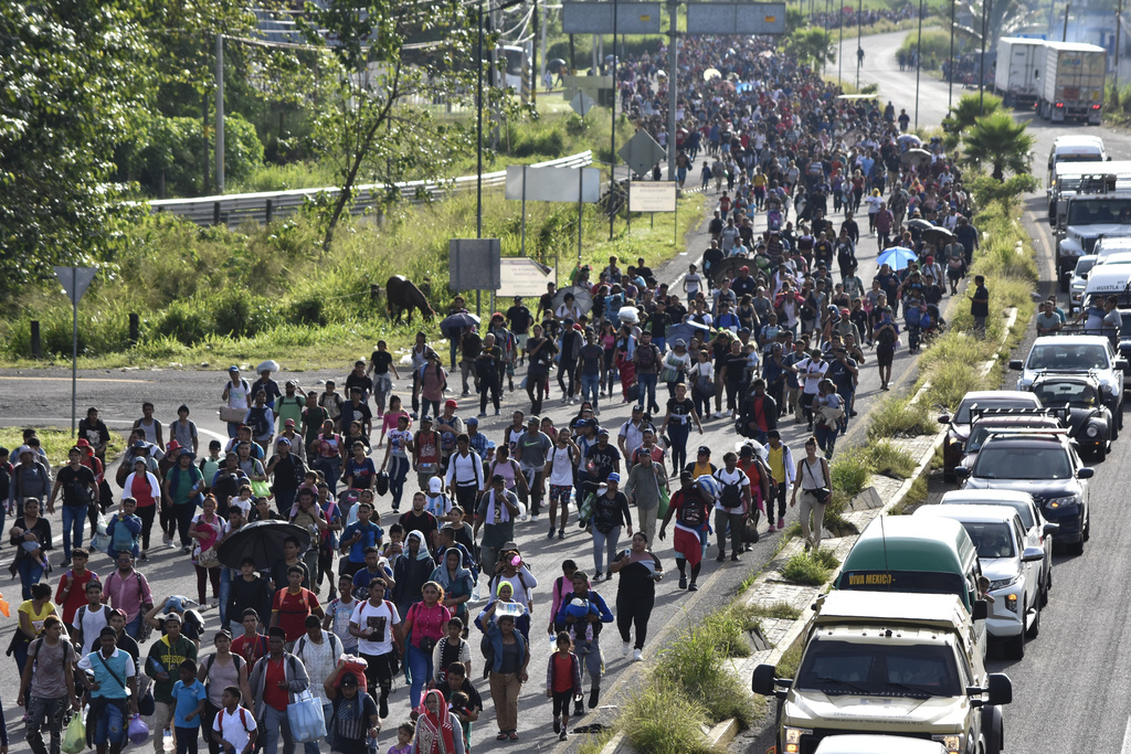 Migrants who had been waiting for temporary transit papers, but failed to get them after waiting, some up to two months, leave Tapachula, Mexico, as they make their way to the U.S. border