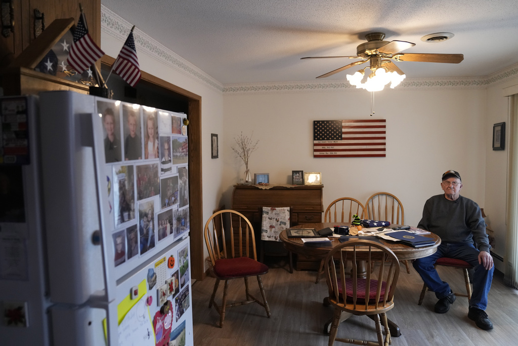 Earl Meyer, who fought for the U.S. Army in the Korean War, sits with war memorabilia at his home, Tuesday, Nov. 7, 2023